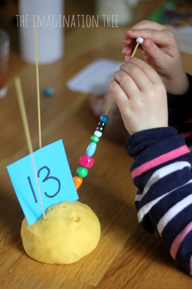 Counting-beads-onto-spaghetti-in-play-dough-666x1000