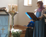 A member of the congregation standing at the front of the church to lead the hymn-singing