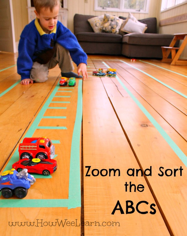 playing with cars and racing to sort the letters is a fun way to practice the abc